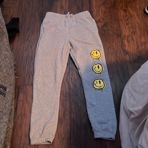 gray with yellow smiley face sweatpants, in good condition